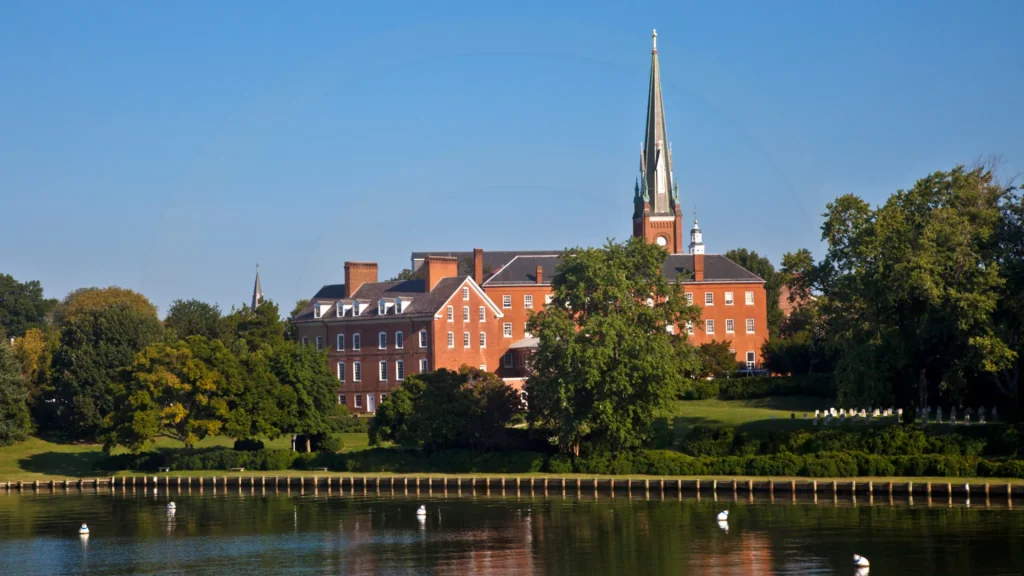 The red brick Charles House as seen from the water.