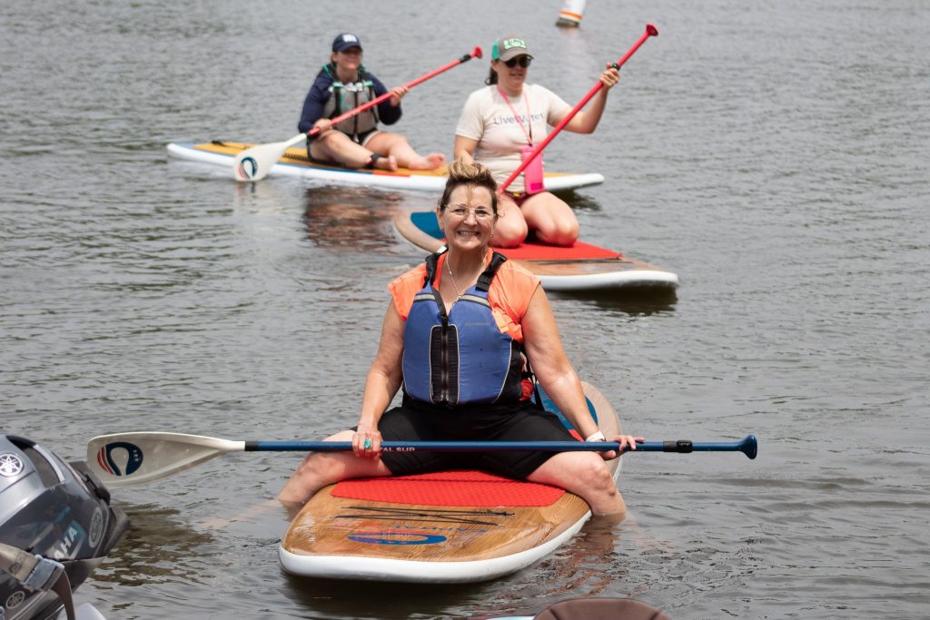 row of paddleboarders