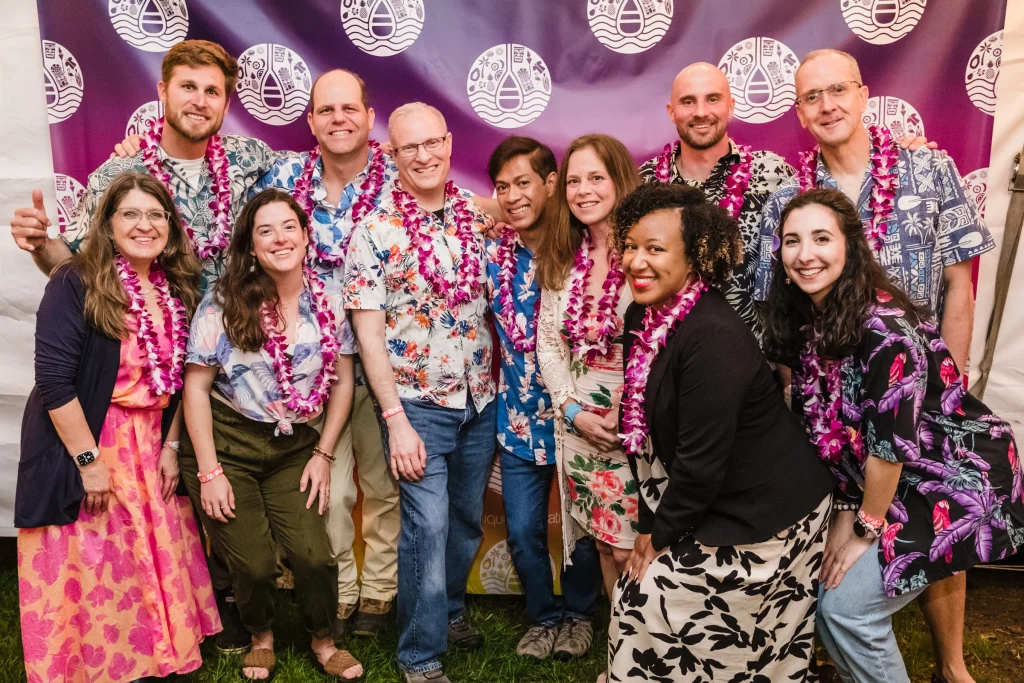 Group photo of the LiveWater board in hawaiian gear