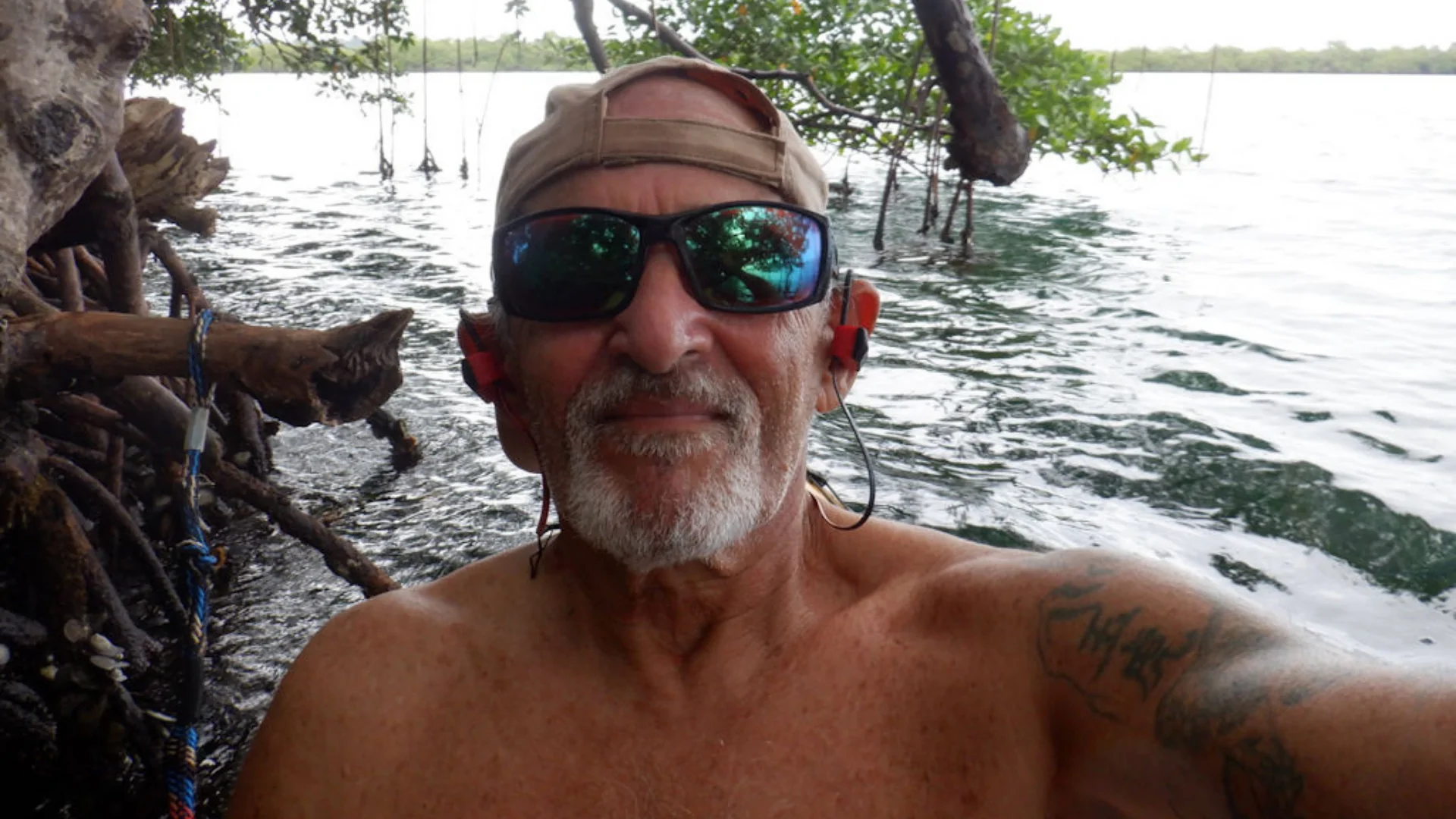 The author, Dennis, takes a close-up selfie alongside the water