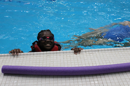 Youth smiling in the pool